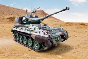 photo of a military tank in the middle of a desert