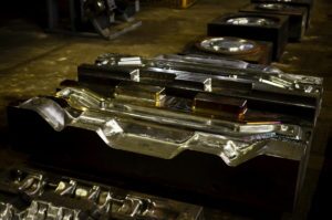 a row of die/tooling that will be used to forged automotive components