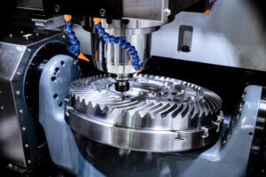 A cog is being machined with a CNC machine